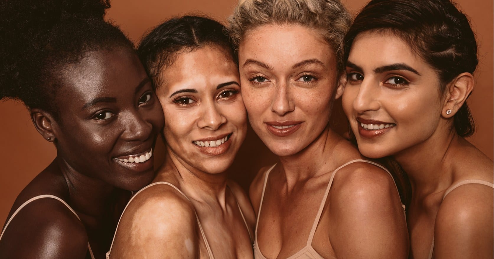 A group of four smiling women