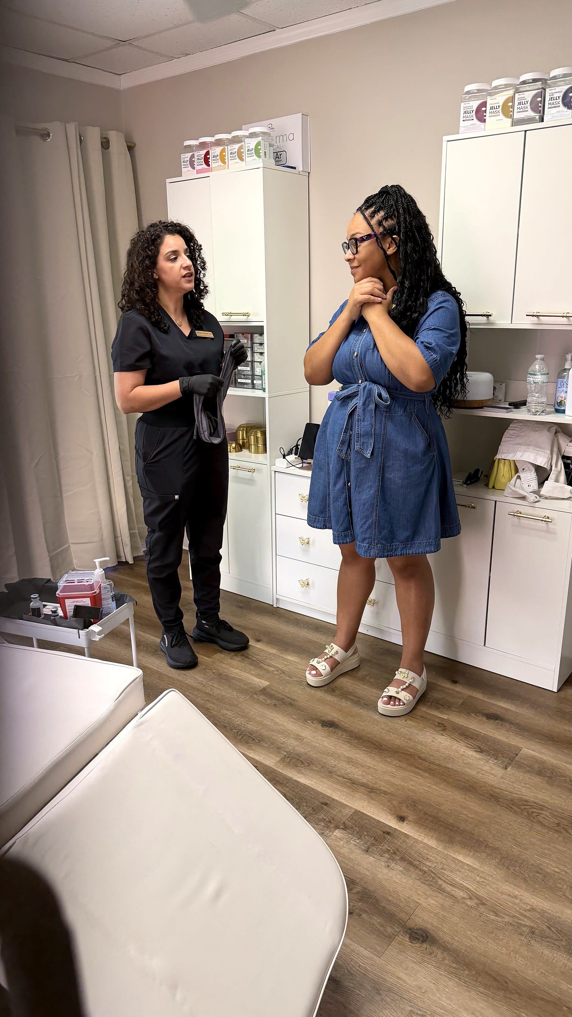 Dr. Espinet consulting with a patient during a concierge house call