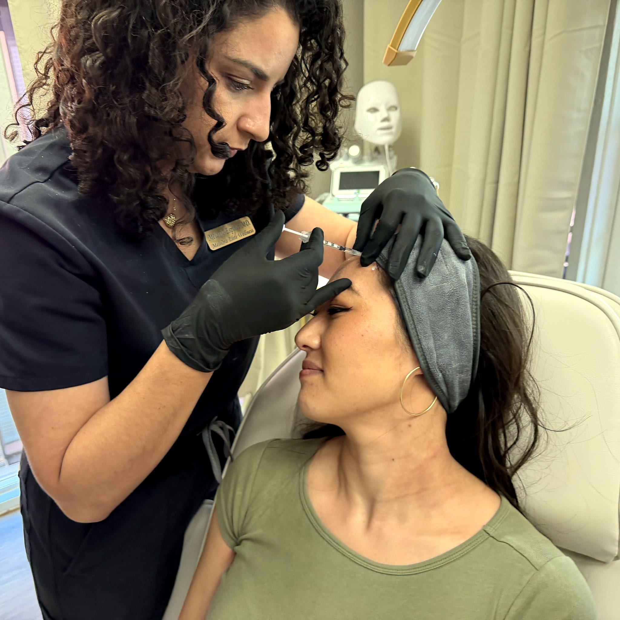 Dr. Espinet administering physician-led concierge Botox